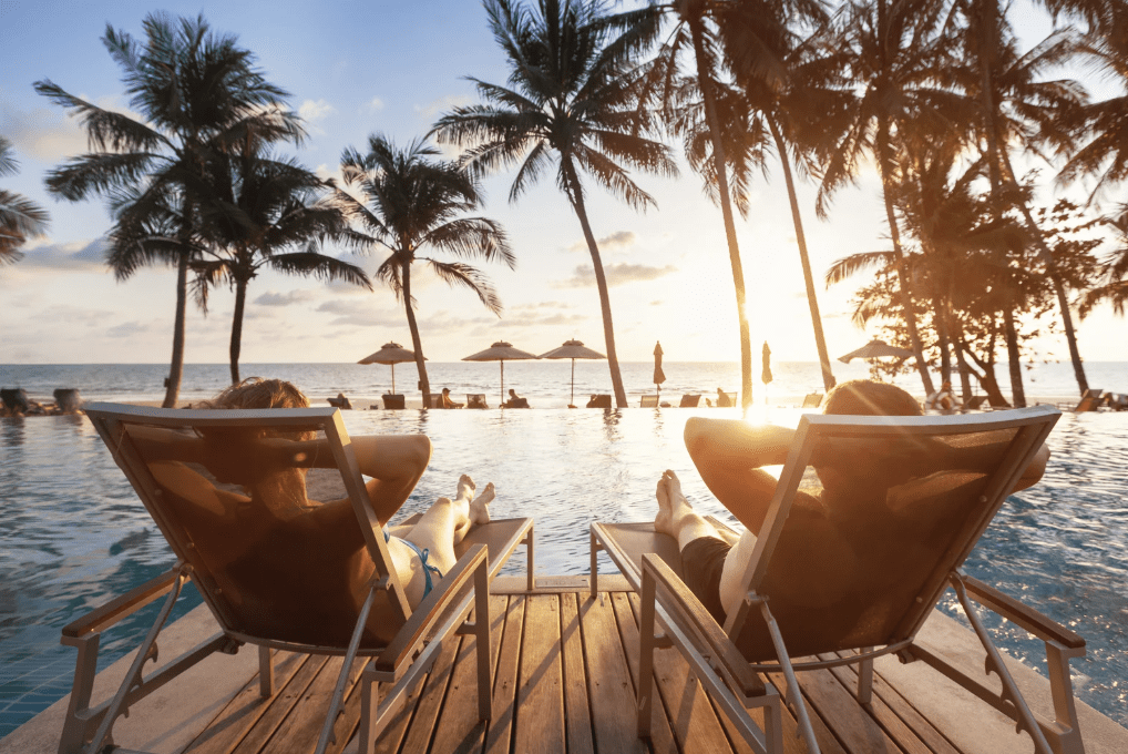 A couple in a tropical setting.