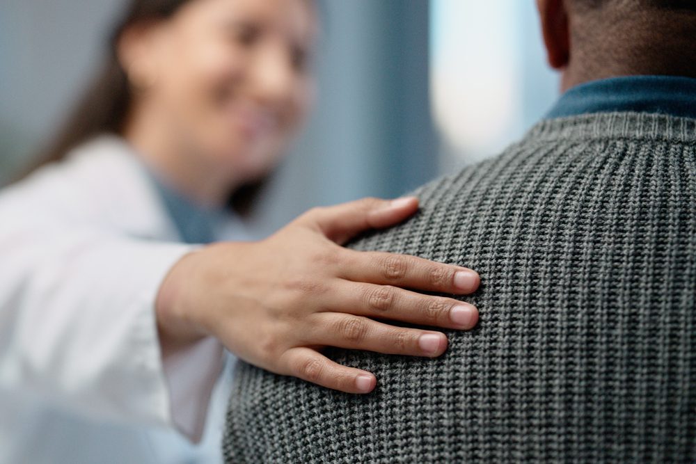 medical associate comforting a patient - detox services - alcohol and drug detox services