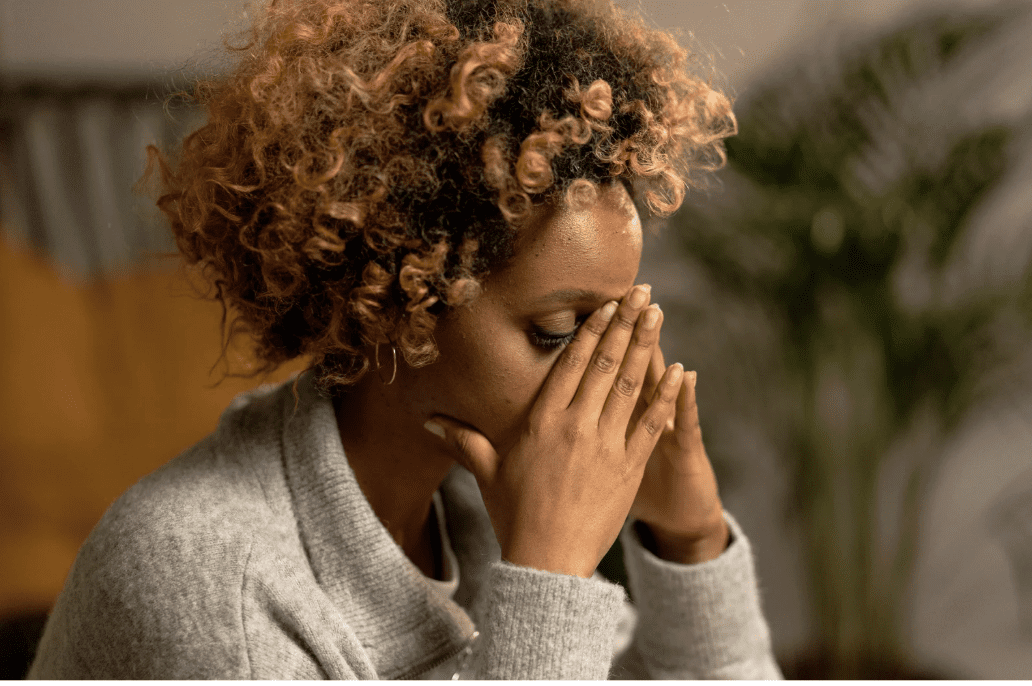 A woman looking stressed.